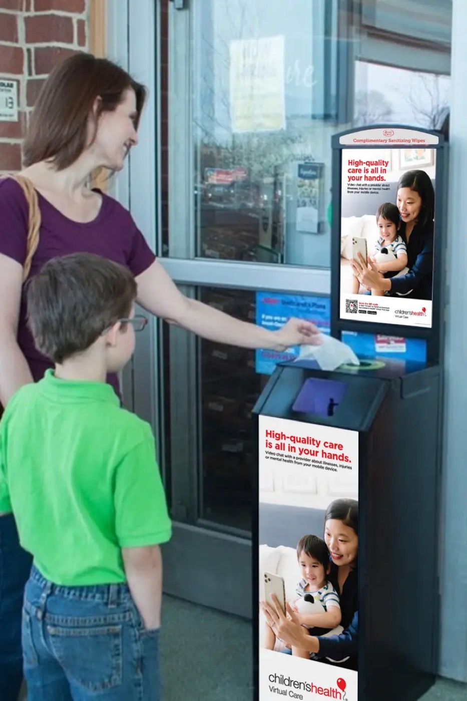 Terraboost wellness kiosk at a grocery store entrance with a top billboard and bottom poster, both showing one advertiser